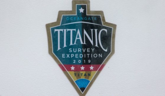 A decal, which reads "Titanic Survey Expedition 2019 Titan," is pictured on a window at OceanGate at the Port of Everett Boat Yard in Everett, Washington, on June 20, 2023.