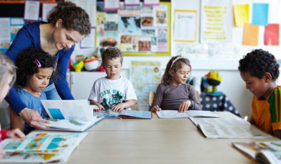 This stock image shows students reading in a classroom.