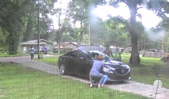 surveillance footage of two men attempting to steal a car from a family