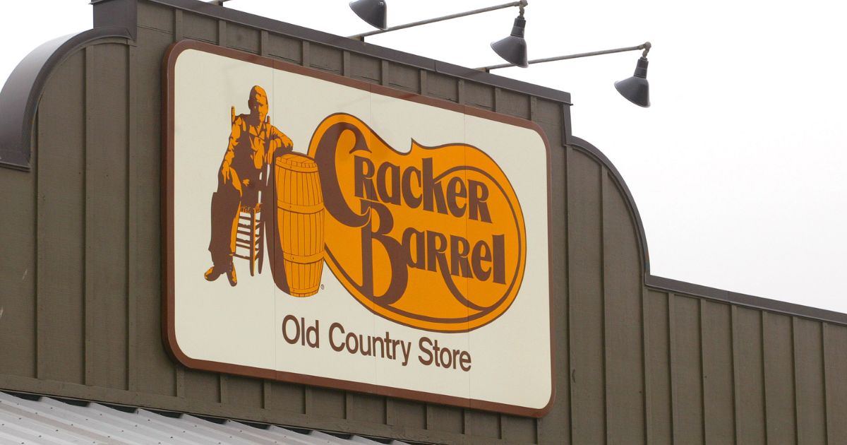 A Cracker Barrel Old Country Store sign is visible atop one of its restaurant stores on April 12, 2002, in Naperville, Illinois.