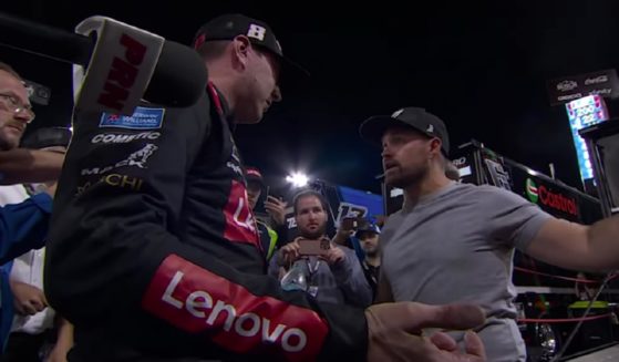 NASCAR drivers Kyle Busch, left, and Ricky Stenhouse Jr. exchange words before a fistfight Sunday in North Wilkesboro, North Carolina.