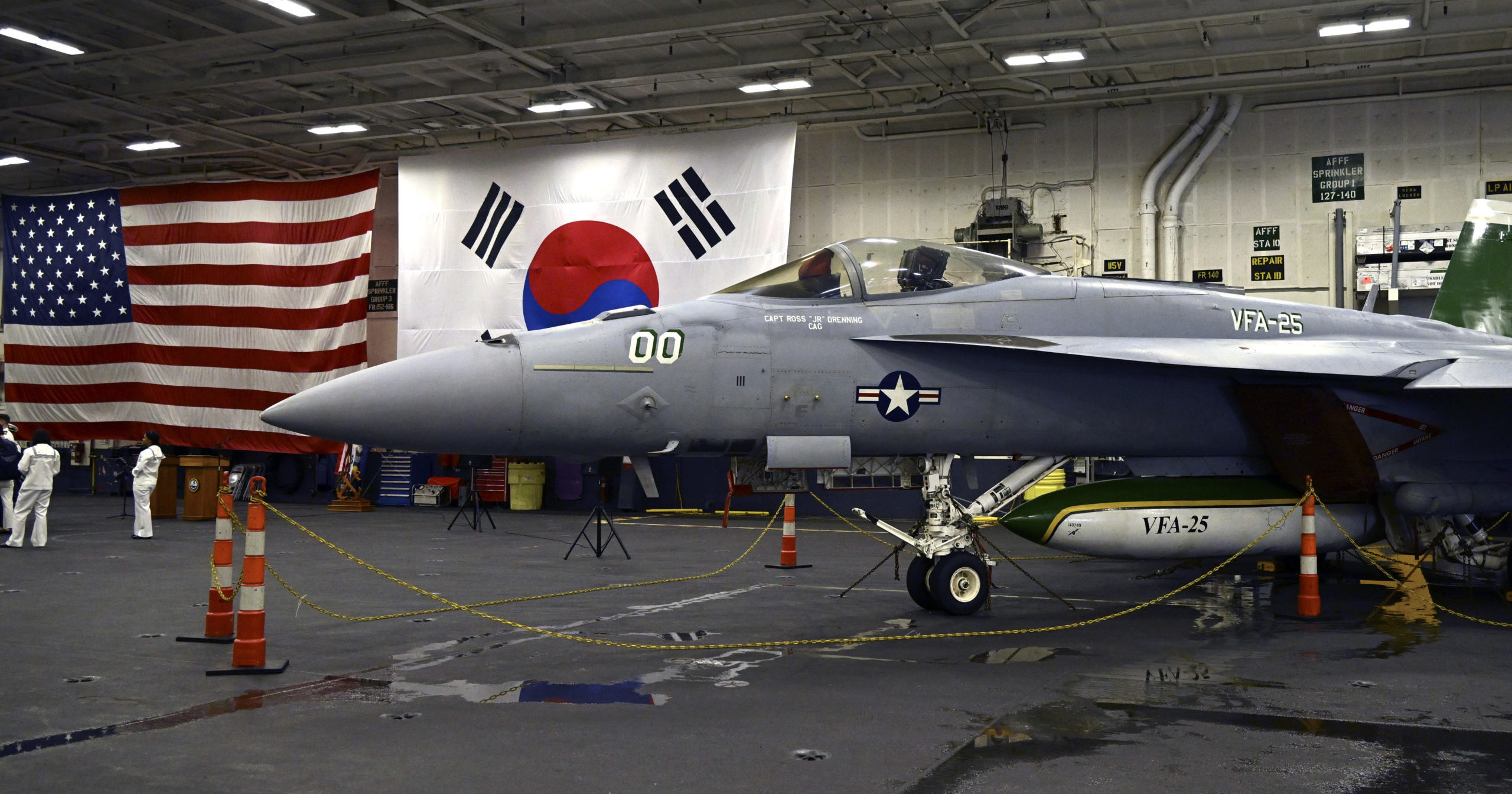 An F-18 fighter aircraft sits in the hanger of the Theodore Roosevelt (CVN 71), a nuclear-powered aircraft carrier anchored in Busan Naval Base in Busan, South Korea Saturday, June 22, 2024.