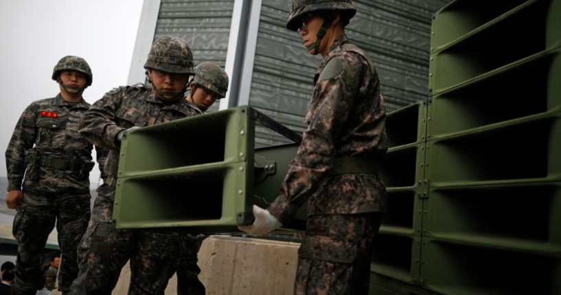 South Korean soldiers dismantle loudspeakers that were set up for propaganda broadcasts near the demilitarized zone separating the two Koreas in Paju, South Korea, on May 1, 2018.