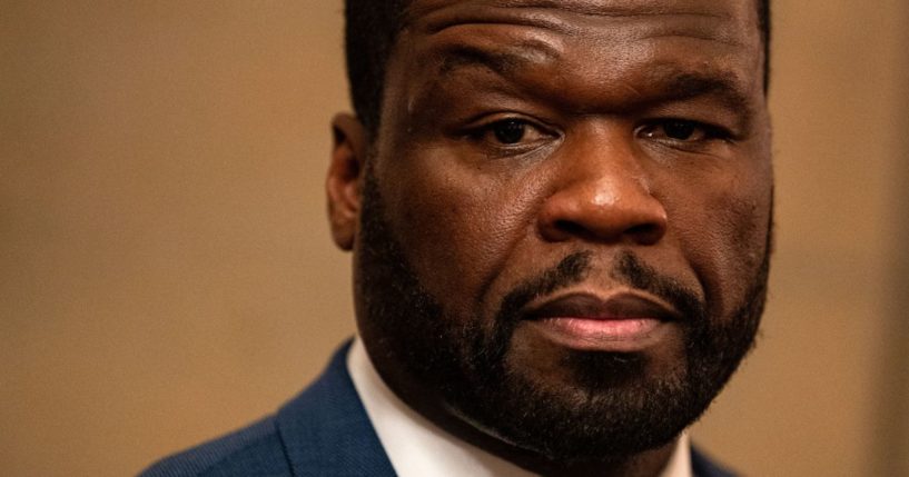 Rapper Curtis "50 Cent" Jackson listens as lawyer Ben Crump speaks to reporters at the U.S. Capitol in Washington, D.C., as they meet with lawmakers about black entrepreneurship on Wednesday.