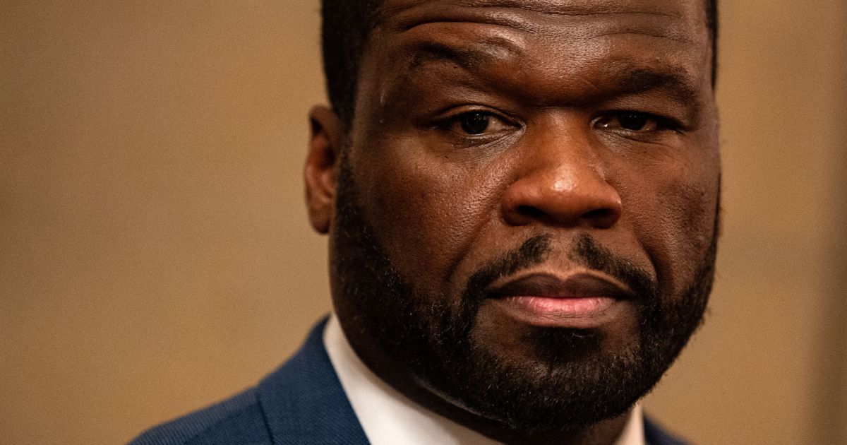 Rapper Curtis "50 Cent" Jackson listens as lawyer Ben Crump speaks to reporters at the U.S. Capitol in Washington, D.C., as they meet with lawmakers about black entrepreneurship on Wednesday.