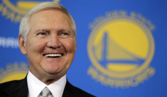 Jerry West smiles after being introduced as a new member of the Golden State Warriors basketball club's Executive Board, during a news conference in San Francisco, California, on May 24, 2011.