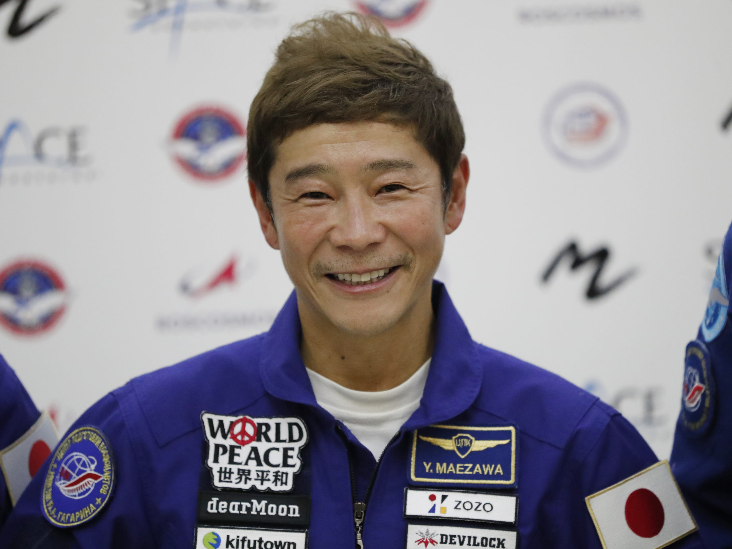 Japanese billionaire Yusaku Maezawa is seen at a 2021 news conference ahead of the expedition to the International Space Station. Maezawa said on June 1 that he has canceled his planned flight around the moon on a Space X spaceship because of uncertainty about when it may be possible.