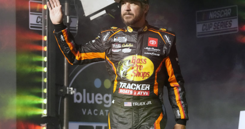 Martin Truex Jr. waves to fans before Daytona 500 qualifying auto races at Daytona International Speedway, Feb. 15, 2024, in Daytona Beach, Florida. Truex announced his retirement from full-time racing Friday, saying it was time to live by his own schedule after 19 full-time seasons as a NASCAR Cup Series driver.