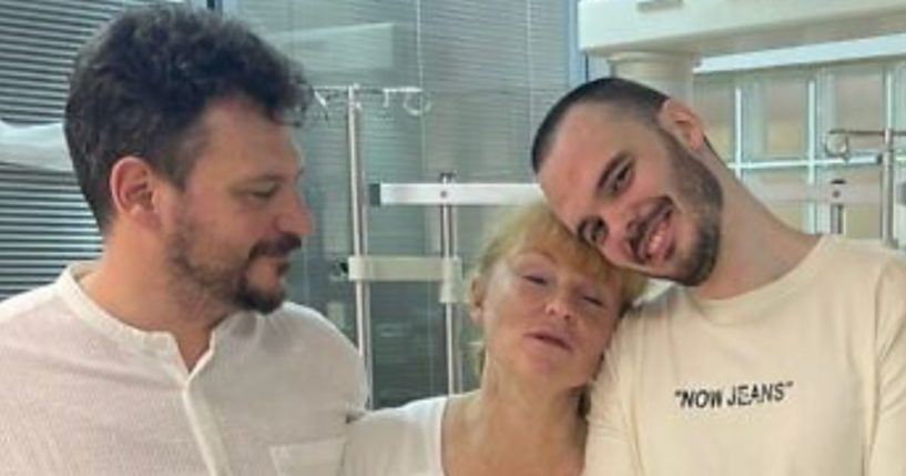 Andrey Kozlov, right, who was held hostage by Hamas since Oct. 7 and rescued June 8, smiles as he is reunited with his parents.