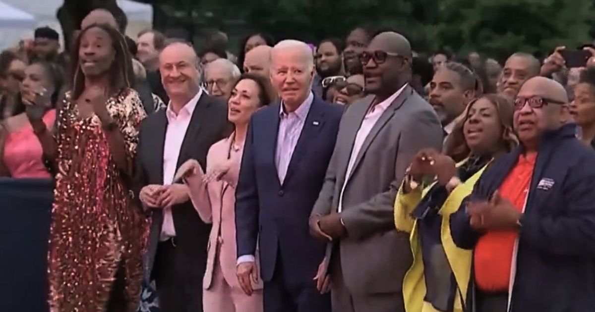 President Joe Biden, center, looks on while others enjoy the Juneteenth celebration at the White House on Monday.