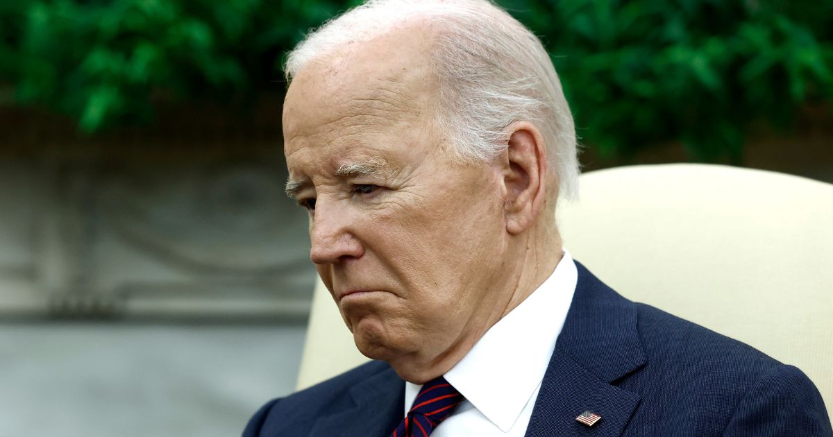 President Joe Biden listens during a meeting in the Oval Office of the White House in Washington on April 15.