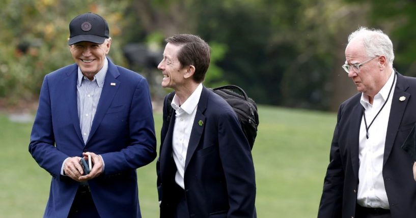 President Joe Biden walks to the White House with senior members of his staff, including Bruce Reed, assistant to the president and deputy chief of staff, and Mike Donilon, senior advisor.