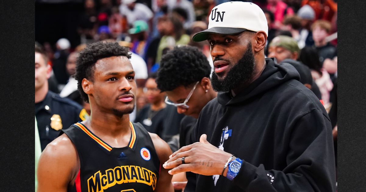 Bronny James, left, talks to his dad, Lebron James of the Los Angeles Lakers, after the 2023 McDonald's High School Boys All-American Game on March 28, 2023 in Houston, Texas.