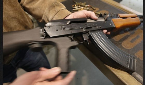 A bump stock is installed on an AK-47 and its movement is demonstrated at Good Guys Gun and Range on Feb. 21, 2018, in Orem, Utah. The bump stock is a device when installed allows a semi-automatic to fire at a rapid rate.