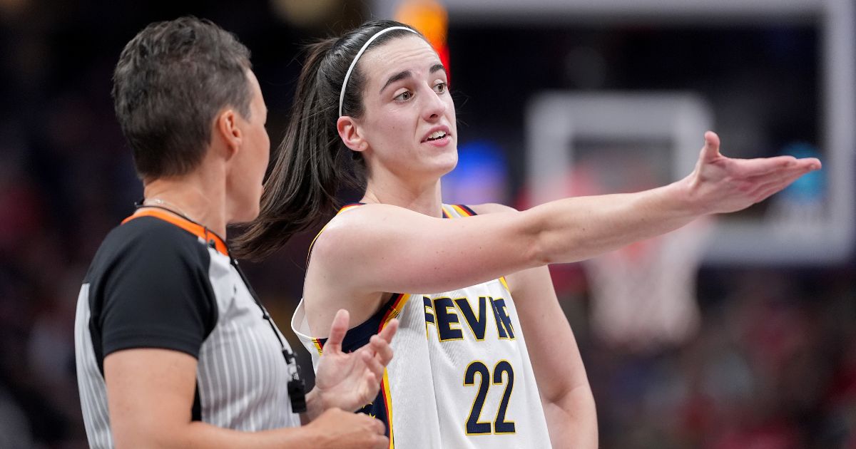 Caitlin Clark of the Indiana Fever argues a call with a referee during the second half of a game against the Washington Mystics at Gainbridge Fieldhouse in Indianapolis on Wednesday.
