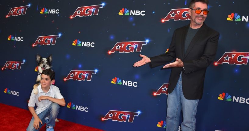 Simon Cowell gestures to his son, Eric Philip Cowell, at the "America's Got Talent" Season 18 finale in Pasadena, California, on Sept. 27, 2023.