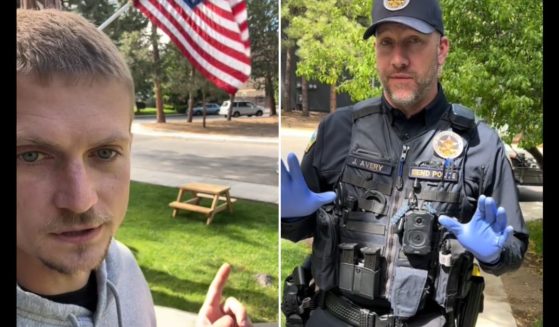 An angry father talks to a police office in Bend, Oregon.