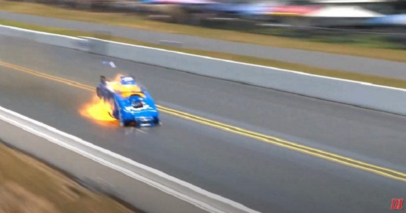 A drag racer driven by racing legen John Force catches fire Sunday at Virginia Motor Sports Park in Dinwiddle, Virginia.