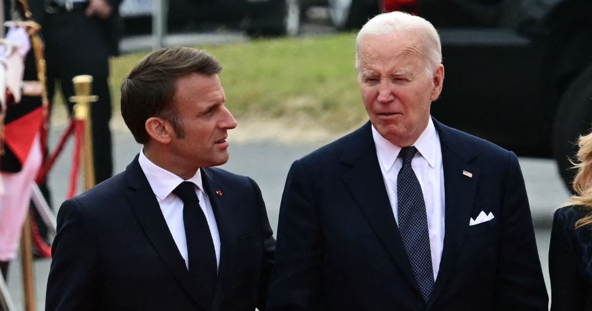 Biden Caught on Hot Mic Explaining Early Departure from D-Day Event