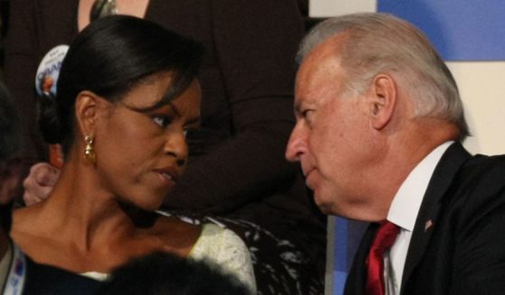 Michelle Obama, left, wife of then-Democratic presidential candidate Barack Obama, shares a moment with then-Sen. Joe Biden of Delaware at the 2008 Democratic National Convention August 26, 2008 in Denver, Colorado.