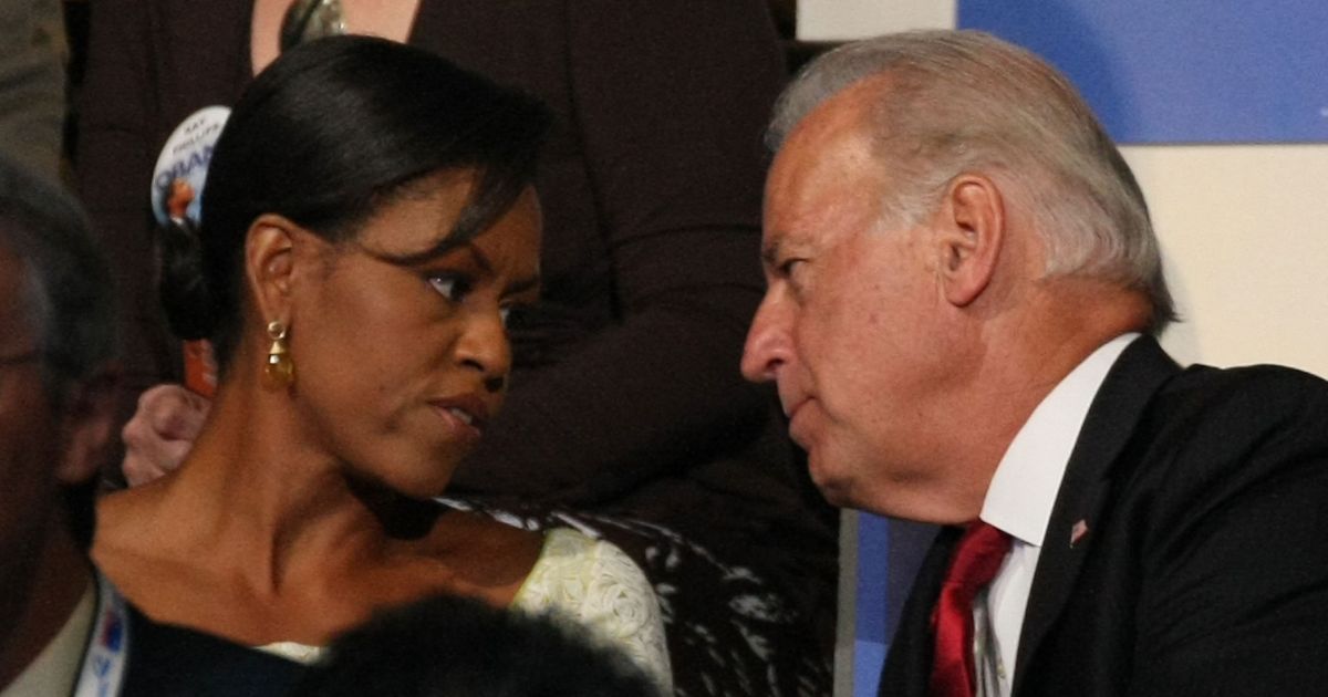 Michelle Obama, left, wife of then-Democratic presidential candidate Barack Obama, shares a moment with then-Sen. Joe Biden of Delaware at the 2008 Democratic National Convention August 26, 2008 in Denver, Colorado.