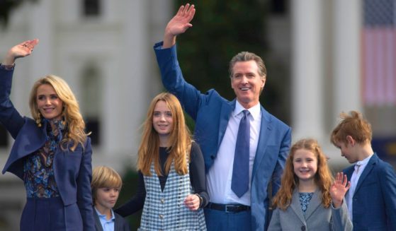 Gov. Gavin Newsom waves with his wife, Jennifer Siebel Newsom, and children Dutch, Montana, Brooklynn, and Hunter following his inauguration in Sacramento, California, on Jan. 6, 2023.