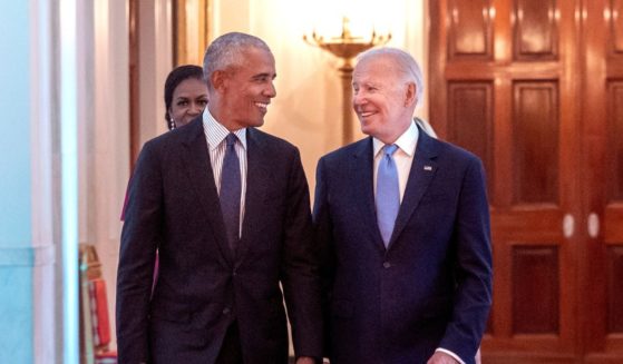 Former U.S. President Barack Obama and U.S. President Joe Biden arrive at a ceremony to unveil the official Obama White House portraits at the White House.