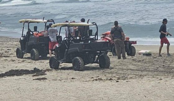 Emergency response vehicles at Hutchinson Island beach in Florida.