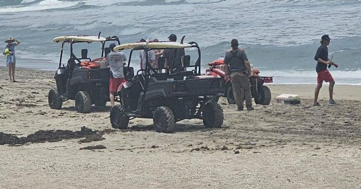 Emergency response vehicles at Hutchinson Island beach in Florida.