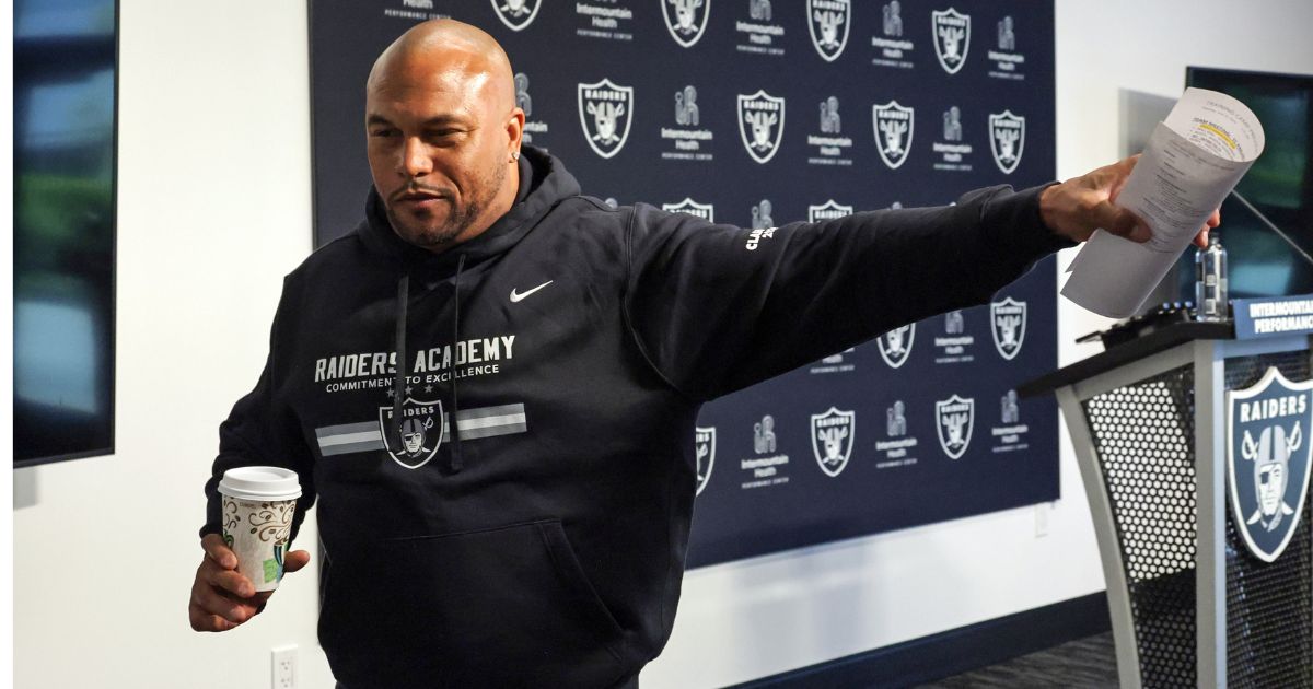 Head coach Antonio Pierce of the Las Vegas Raiders waves as he leaves a news conference during mandatory minicamp at the Las Vegas Raiders Headquarters / Intermountain Healthcare Performance Center on June 13 in Henderson, Nevada.