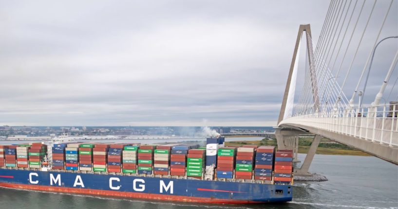 a container ship passing under the Ravenel Bridge in Charleston Harbor