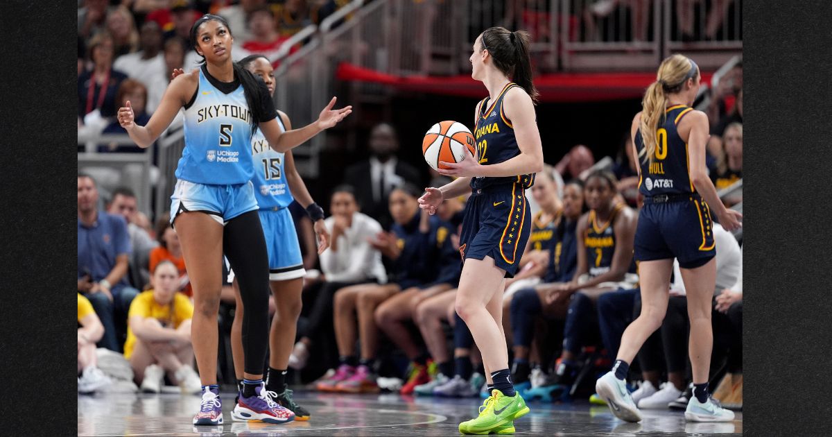 Angel Reese #5 of the Chicago Sky reacts after fouling Caitlin Clark #22 of the Indiana Fever during the second half at Gainbridge Fieldhouse on Sunday in Indianapolis, Indiana.