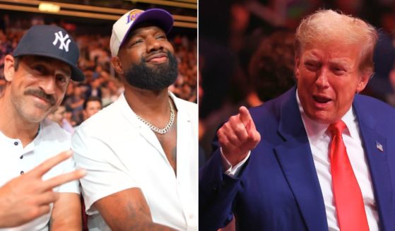 NFL quarterback Aaron Rodgers, left, and former President Donald Trump, right attend UFC 302 at the Prudential Center in Newark, New Jersey, on Saturday.