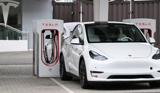 A Tesla electric vehicle charges at a Tesla Supercharger location in Santa Monica, California, on May 15.