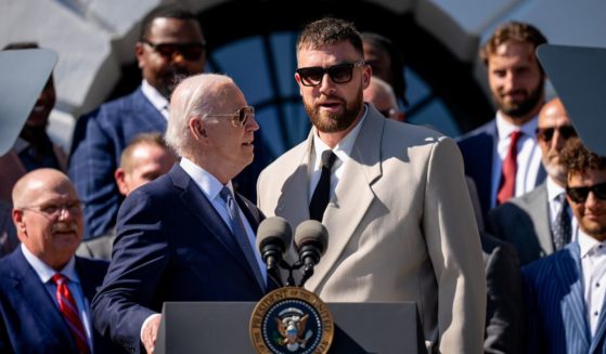President Joe Biden invites tight end Travis Kelce of the Kansas City Chiefs to speak during an event on the South Lawn of the White House in Washington on May 31.