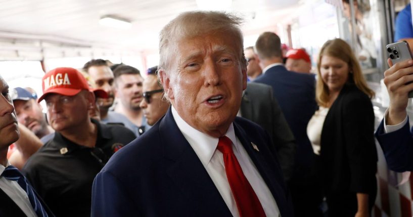 Republican presidential candidate and former President Donald Trump greets people at Tony and Nick's Steaks in Philadelphia on Saturday.