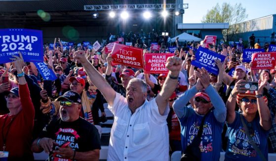 The crowd reacts while former President Donald Trump speaks during a rally in Freeland, Michigan, on May 1.