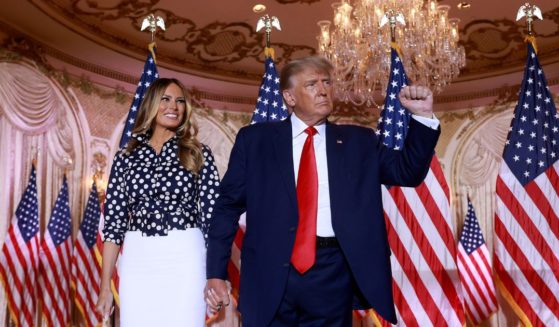 Former U.S. President Donald Trump and former first lady Melania Trump stand together during an event at his Mar-a-Lago home on November 15, 2022 in Palm Beach, Florida.