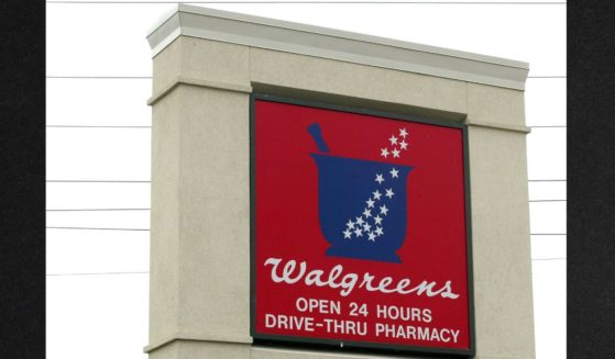 Walgreens signage is displayed outside a Walgreens store in Niles, Illinois in a 2003 file photo.