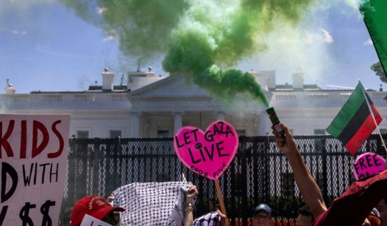 Pro-Palestinian activists set off smoke bombs on Pennsylvania Avenue in front of the White House during a demonstration protesting the war in Gaza on June 8, 2024, in Washington, D.C.