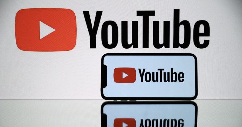 The logo of YouTube is displayed on both a smartphone and a tablet on Oct. 5, 2021.