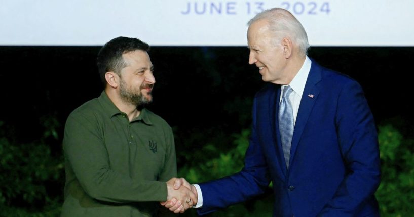 Ukrainian President Volodymyr Zelenskyy, left, shakes hands with President Joe Biden during a news conference at the Masseria San Domenico in Savelletri, Italy, on June 13.