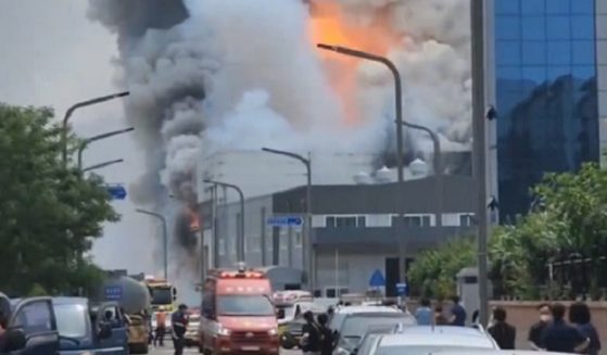 Fire rages at a lithium battery factory in Hwaseong, South Korea, on Sunday.