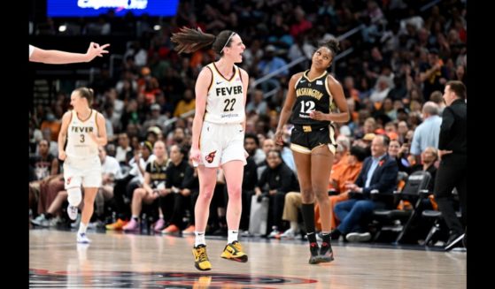 Caitlin Clark #22 of the Indiana Fever celebrates after scoring in the third quarter against the Washington Mystics at Capital One Arena on June 7, 2024 in Washington, DC.