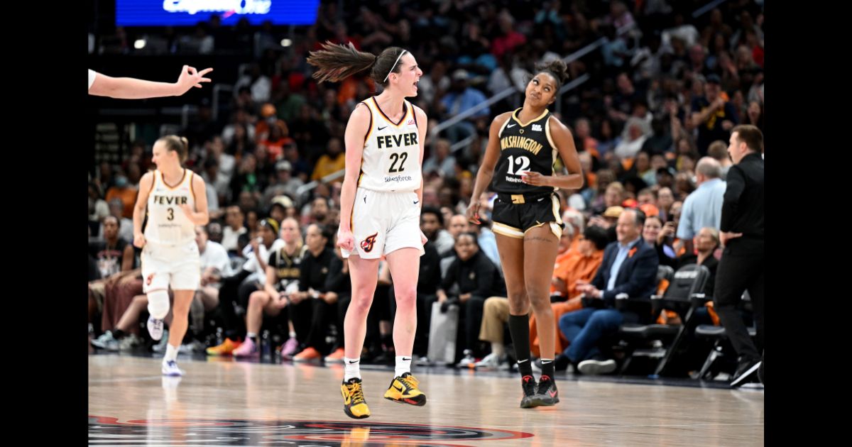 Caitlin Clark #22 of the Indiana Fever celebrates after scoring in the third quarter against the Washington Mystics at Capital One Arena on June 7, 2024 in Washington, DC.