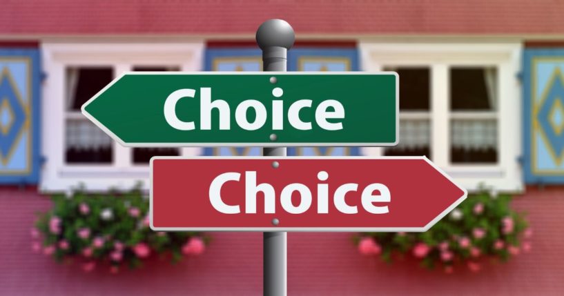 This image shows two road signs pointing in opposite directions with the word 'choice' on both.