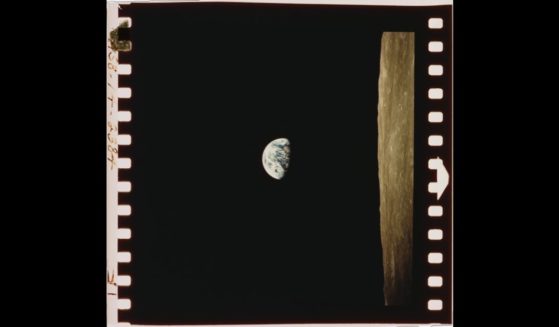 A view of the Earth beyond the lunar horizon, taken from the Apollo 8 spacecraft while in orbit around the Moon, by crewmember Bill Anders, 24th December 1968.