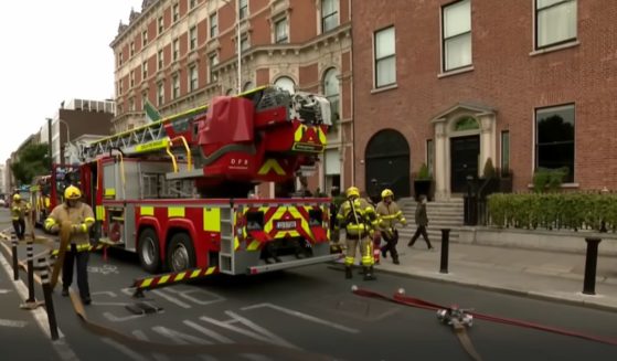 Firefighters are at the scene of a fire at the historic Shelbourne Hotel in Dublin on Wednesday.