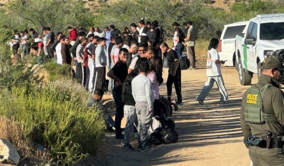 About 200 illegals are seen after crossing the border into California.