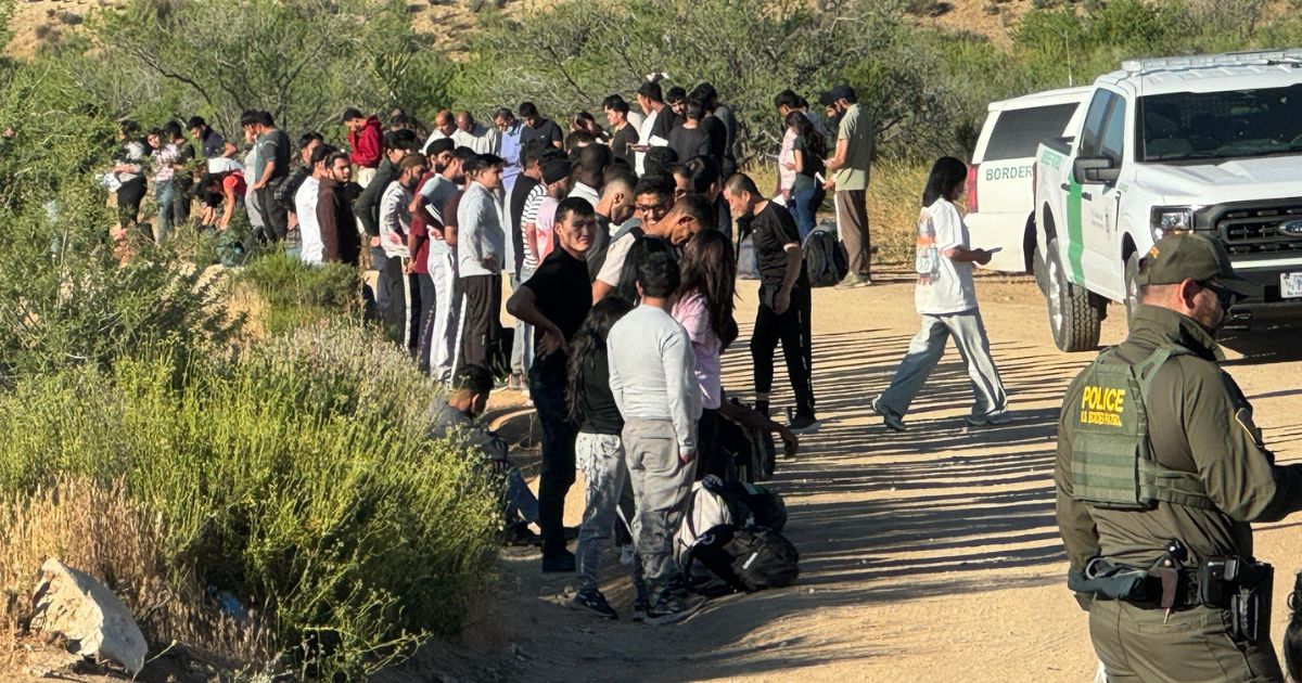 About 200 illegals are seen after crossing the border into California.